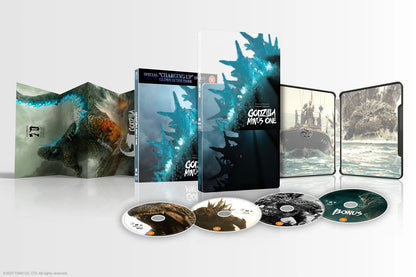 Godzilla Minus One 4K Ultra HD home video box set, featuring the outer slipcase, inner slipcase, steelbook case, Blu-ray disc, and bonus disc, all displaying artwork of Godzilla and a submarine on a light gray background.